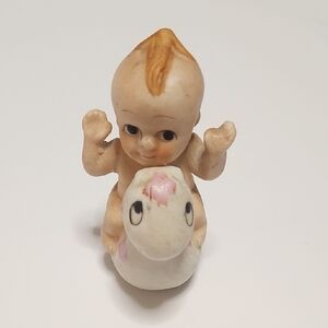 Charming Ceramic Baby Figurine with Pink Accents